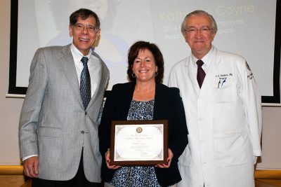 Kathleen Coyne, recipient of the Peter J. Deckers Employee Appreciation Award, with Dr. Frank Torti (left) and Dr. Peter Deckers.