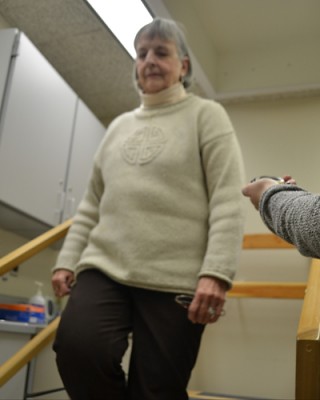 INFINITY Trial participant Fran Kehoe is timed and observed walking up and down stairs. (Chris DeFrancesco/UConn Health Photo)