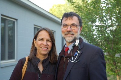 Univision producer Emilce Elgarresta and Dr. Bruce Gould, founder of the migrant farm worker clinics, during the video shoot at Thrall's Tobacco Farm in Windsor.