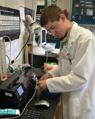 M.D./Ph.D. student Alex Adami in the lab (Chris DeFrancesco/UConn Health)