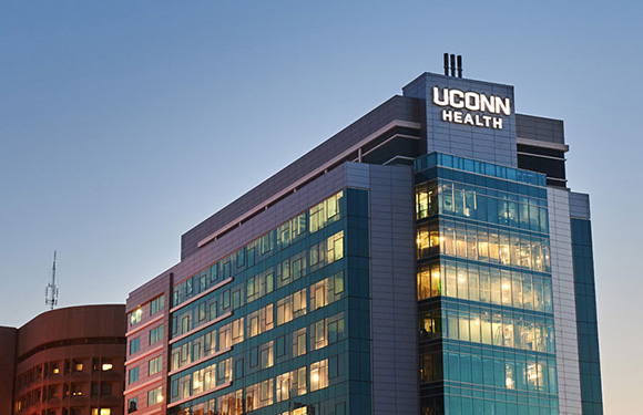 A night view of University Tower at UConn John Dempsey Hospital (Janine Gelineau/UConn Health)