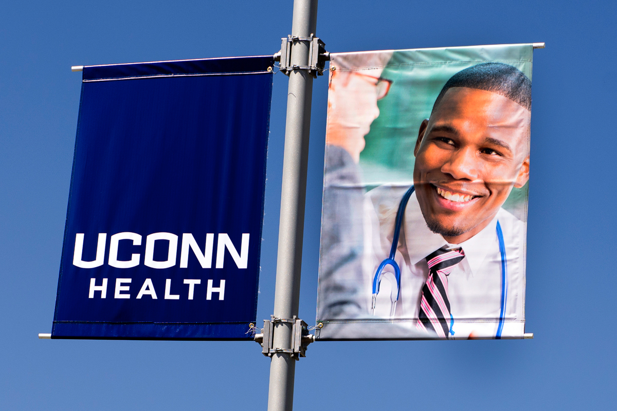 Physician examines patient, UConn Health
