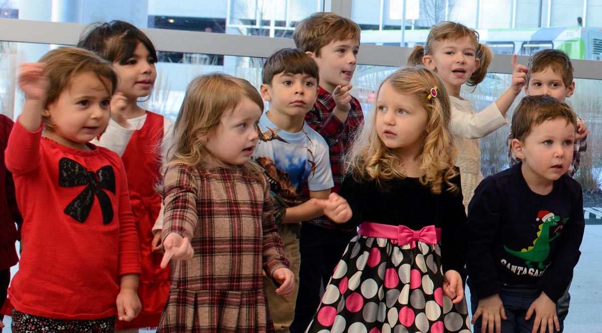 Preschoolers from the Child Care Center perform their holiday concert in the Outpatient Pavilion (Janine Gelineau/UConn Health)
