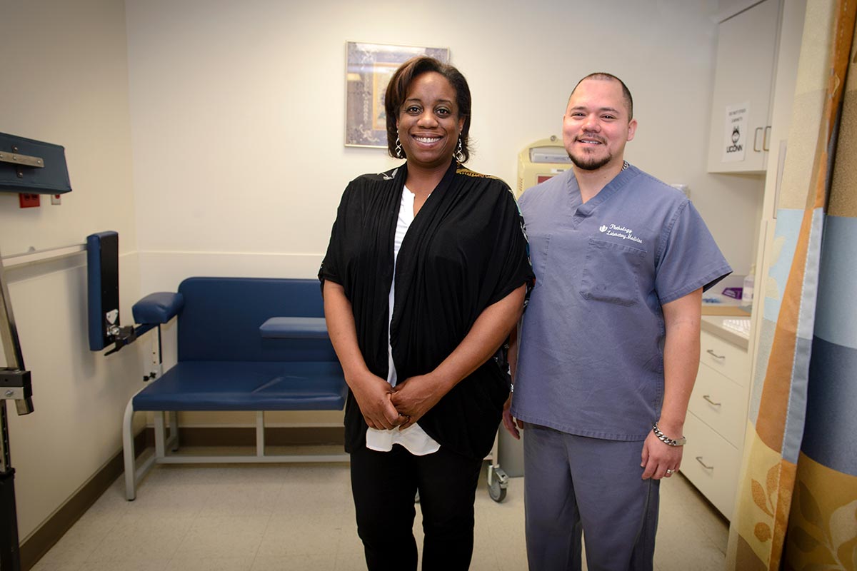 Latonya Robbs-Joseph and Juan Carlos Restrepo are credited with saving the life of an infant who had stopped breathing in the clinical lab Jan. 17. (Photo by Janine Gelineau)